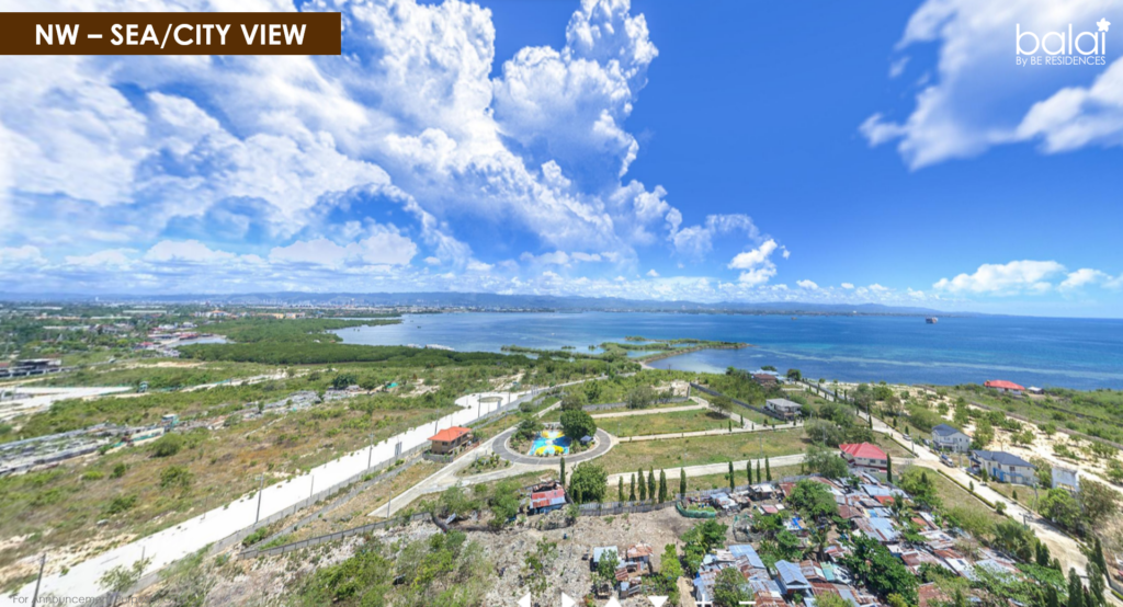 Balai Punta Engaño by BE Residences' northwest drone shot showing city and sea view